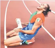  ?? — AFP file photos ?? Italy’s Gianmarco Tamberi celebrates on the track following the men’s high jump Final during the Tokyo 2020 Olympic Games at the Olympic Stadium in Tokyo.