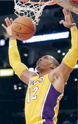  ?? Luis Sinco
Los Angeles Times ?? IT WAS NO SLAM DUNK for Dwight Howard to accept $30 million extra to stay with the Lakers, who pulled out all the stops to try to retain the free agent.