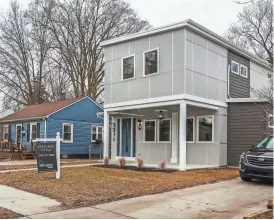  ??  ?? This shipping container home, above, in Ferndale, Mich., was built on an empty lot and is made up of five and a half shipping containers. In March, it was on the market for $450,000.