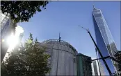  ?? JESSIE WARDARSKI — THE ASSOCIATED PRESS ?? Workers install marble on the exterior of St. Nicholas Greek Orthodox Church and National Shrine in New York Sept. 2.