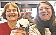  ?? Contribute­d photo ?? Lapin, left, and Czuba enjoy a sweet ending to their hiking jaunt at Friendly’s.