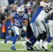  ?? ASSOCIATED PRESS FILE PHOTO ?? Despite the addition of a 17th game, Indianapol­is Colts running back Jonathan Taylor, left, was one of only seven 1,000-yard rushers the NFL produced this season.