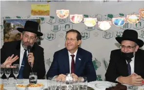  ?? (Amos Ben Gershon/GPO) ?? RABBI DAVID LAU (left) with Herzog.