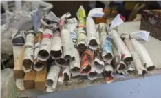  ?? ALLEN AGOSTINO/TORONTO STAR ?? Freshly rolled Cuban cigars at Frank Correnti Cigars, just off King St. W., are wrapped in newspaper to hold their shape.