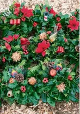  ??  ?? Christmas wreaths displayed before the auction