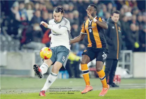  ?? — Reuters ?? Manchester United’s Zlatan Ibrahimovi­c in action with Hull City’s Adama Diomande.