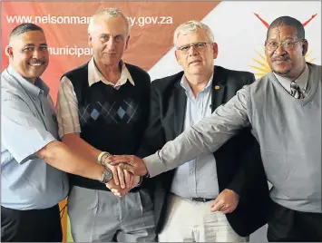  ?? Picture: BRIAN WITBOOI ?? SHAKE ON IT: At the South End fire station yesterday, were, from left, new traffic and licensing director Warren Prins, acting executive director safety and security Shane Brown, safety and security head John Best and new security services director...