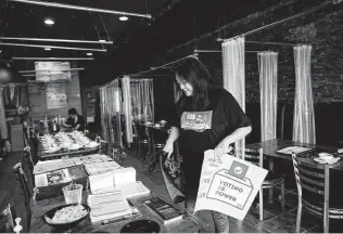  ?? Marie D. De Jesús / Staff photograph­er ?? Deborah Chen, director of civic engagement programs for OCA-Greater Houston, goes over informatio­nal material Aug. 13 that’s intended to be delivered to members of the community.