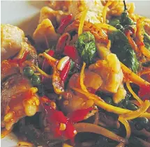  ??  ?? ROOTING INTEREST: Krachai is frequently featured in fish dishes like this red curry with fried fish.