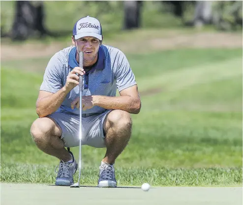  ?? WAYNE CUDDINGTON/ POSTMEDIA NEWS ?? NHL referee Garrett Rank of Elmira lines up his putt on the 14th hole on Day 1 of the Canadian Amateur Golf Championsh­ip held at the Royal Ottawa Golf Club in Gatineau, Que. Rank was tied for 17th after the first round.