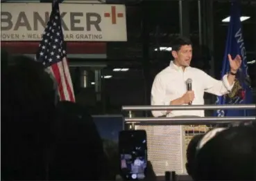  ?? SCOTT BAUER — THE ASSOCIATED PRESS ?? U.S. House Speaker Paul Ryan responds to a question from a Republican voter during an employee town hall on Wednesday in Mukwonago, Wis. Frustrated Republican­s vented their displeasur­e at Ryan on Wednesday during the town hall meeting at a wire...