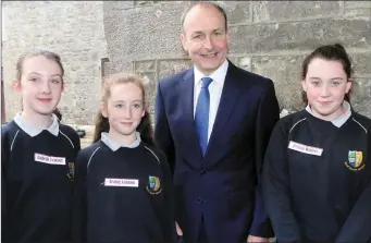  ??  ?? Fianna Fáil party leader, Micheál Martin with Grange National School pupils, Isabelle Yewlett, Aisling Cannon and Jessica Watters at Lissadell House last Wednesday.