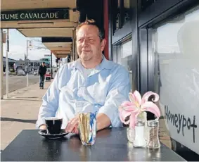  ?? Photo: DAVID HALLETT/FAIRFAX NZ ?? Better times: Outgoing owner Rob Gould outside Christchur­ch’s Honeypot Cafe at the time of its reopening in
Sydenham.