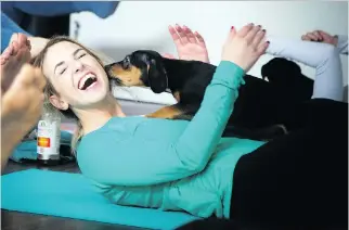  ?? PHOTOS: ASHLEY FRASER ?? Ottawa’s first puppy yoga class took place Saturday at Inner Soul and Cycle as a fundraiser for Ottawa Dog Rescue. This puppy was a big fan of Erika Polidori.