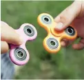  ??  ?? GADGET: Fidget spinners can help with concentrat­ion and anxiety.