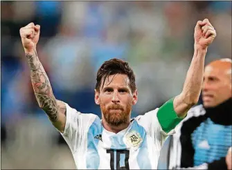  ?? THE ASSOCIATED PRESS DMITRI LOVETSKY/ ?? Argentina’s Lionel Messi celebrates Tuesday after the group D match between Argentina and Nigeria at the 2018 World Cup in the St. Petersburg Stadium in St. Petersburg, Russia. Argentina won 2-1.