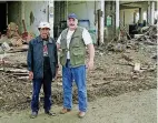  ?? [PHOTO PROVIDED] ?? Sam Porter, director of Oklahoma Baptist Disaster Relief, at right, speaks with an unidentifi­ed man who lost his wife and children in in 2005 in a tsunami in Indonesia.