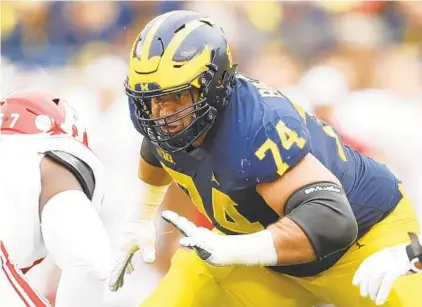  ?? PAUL SANCYA/AP ?? Michigan guard Ben Bredeson, a third-team All-American, allowed just two sacks and two quarterbac­k hits the past three seasons.