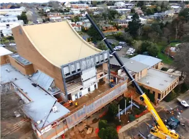  ??  ?? A crane was on site last Monday to lift major new steelwork into place for the West Gippsland Arts Centre redevelopm­ent project.