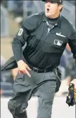  ?? ?? YOU’RE OUTTA HERE! Home-plate umpire John Bacon follows through on his ejection of Aaron Boone (inset) for arguing balls and strikes on Wednesday.