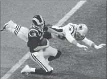  ?? Los Angeles Times/tns ?? Los Angeles Rams’ quarterbac­k Jared Goff goes down for a sack by New England Patriots linebacker Kyle Van Noy during Super Bowl LIII on Sunday in Atlanta.