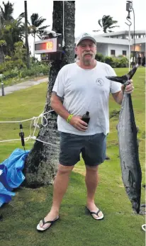  ?? Photo: Krystel Gough ?? AnglerJohn Andrews of Team Maverick with his wahoo on July 13, 2018.