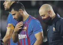  ?? Reuters ?? Barca striker Sergio Aguero leaves the pitch due to chest pains during the match at Camp Nou on Saturday