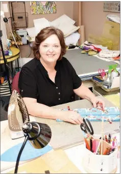  ?? STACI VANDAGRIFF/TRILAKES EDITION ?? Carolyn Brinkley makes purses from her home in Arkadelphi­a. She is among the newest artists on the Caddo River Arts Guild Round About Artists Studio Tour and will display her handcrafte­d purses and accessorie­s during the event, set for Oct. 18-20.