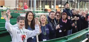  ?? PHOTOS: DCTT ?? Volunteers on board a boat outside the trust’s headquarte­rs at The Portal building.