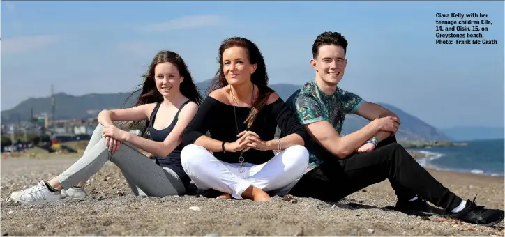  ??  ?? Ciara Kelly with her teenage children Ella, 14, and Oisin, 15, on Greystones beach. Photo: Frank Mc Grath