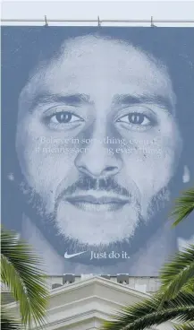  ?? Photo / AP ?? A large billboard showing Colin Kaepernick, atop a Nike store in San Francisco.