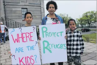  ?? JUANITA MERCER/THE TELEGRAM ?? Moses Simon, Mieraf Mezgebo, and Steven Simon attended the Rally to End Family Separation. Mezgebo said it’s important to speak out against what is happening at the United States-mexico border. Before she arrived in Canada three years ago, Mezgebo was...