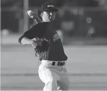  ?? TYLER BROWNBRIDG­E ?? The Windsor Junior Selects’ Matt Krutsch throws against the Tecumseh Thunder at Lacasse Park in Tecumseh Wednesday.