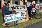  ?? HELEN HARVEY/STUFF ?? Climate Justice Taranaki protests outside an oil company every week.