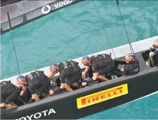  ?? Ricardo Pinto / ACEA ?? The crew of Emirates Team New Zealand appears locked in while racing Britain’s Land Rover BAR during an America’s Cup challenger semifinal on the Great Sound in Bermuda.
