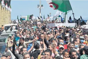  ??  ?? CONFRONTIN­G POLICE: Algerians shout slogans during an antigovern­ment demonstrat­ion in the capital Algiers on Friday.