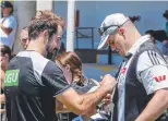  ??  ?? Steele Sidebottom signs an autograph for a Magpies fan on the Gold Coast.