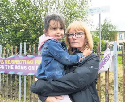  ??  ?? Devastated Young Georgie with her gran Moira outside Townhead Nursery