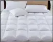  ??  ?? Easy to use: The mattress toppers attach firmly to your bed