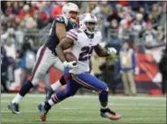  ?? STEVEN SENNE — THE ASSOCIATED PRESS FILE ?? In this file photo, Buffalo Bills running back LeSean McCoy (25) runs from New England Patriots defensive end Trey Flowers, rear, during the second half of an NFL football game in Foxborough, Mass. The Bills have not been to the playoffs since the...