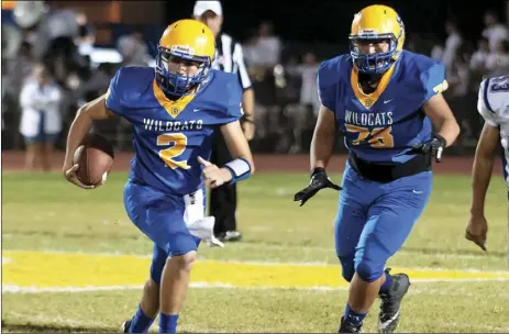  ??  ?? Brawley’s Jacob Ramirez (2) sprints to his left during the Bell Game on Oct. Wildcats to four wins after taking over at quarterbac­k following an injury to SERGIO BASTIDAS