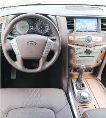  ?? JIL MCINTOSH/DRIVING ?? The Infinity QX80 Limited trimline features ash wood trim, faux-suede headliner and quilted, piping-edged seats.