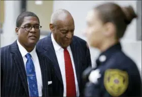  ?? MATT SLOCUM — THE ASSOCIATED PRESS ?? Bill Cosby, center, arrives for a pretrial hearing in his sexual assault case Friday at the Montgomery County Courthouse in Norristown.