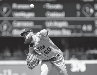  ?? Lindsey Wasson / Getty Images ?? Dallas Keuchel pitched seven innings Wednesday, allowing three runs on eight hits and a walk as he evened his record at 9-9 and gave the Astros a 6-3 mark against the Mariners this season.
