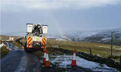  ?? ?? Power cables damaged by Storm Arwen last month undergo repair in Teesdale on Sunday. Photograph: Ian Forsyth/Getty Images