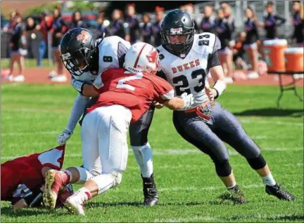  ?? TANIA BARRICKLO — DAILY FREEMAN ?? Marlboro’s Billy Williamson tries to elude Red Hook’s Tristen Schiafo while teammate Phillip Desantis tries to clear the way during Saturday’s game at Red Hook.