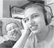  ?? FRESH TAKE FLORIDA ?? Dan Miller, 57, and his son Nathan Miller, 17, pose for selfies together in their house in Lake Worth.