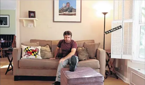  ?? Photograph­s by Jesse Goddard Los Angeles Times ?? A SOFA PILLOW combines Maryland images; the sign on the right has special family meaning for the “Drunk History” host.