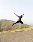  ??  ?? A hiker takes a jump