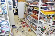  ?? KYODO NEWS VIA AP ?? Products are scattered at a convenienc­e store in Fukushima, northern Japan March 16followin­g an earthquake.